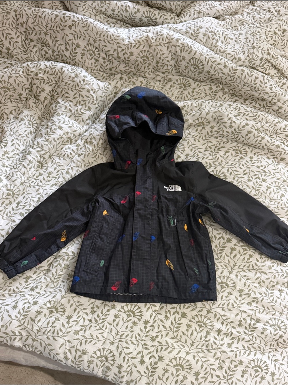 The North Face Black Kids' Hooded Raincoat with Multi-Color Prints